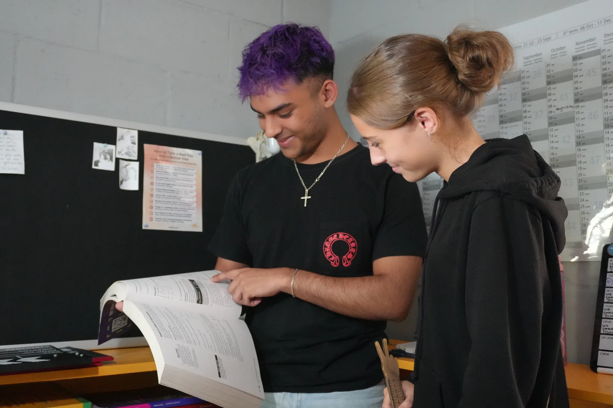 Two learners working through study material together