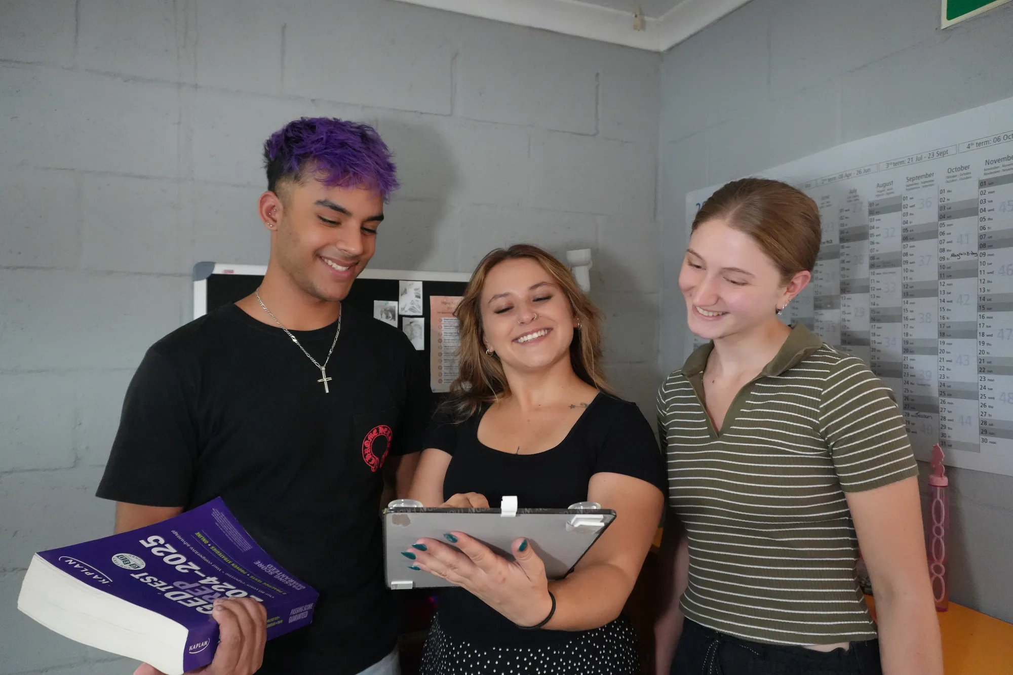 Sadie sharing a learning activity with two students